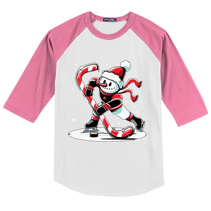 A snowman playing hockey with a candy cane hockey stick Kids Colorblock Raglan Jersey