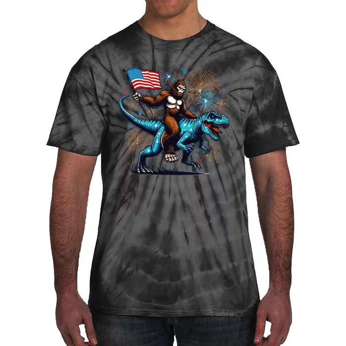 Bigfoot Fireworks Riding A Trex With Usa Flag Tie-Dye T-Shirt