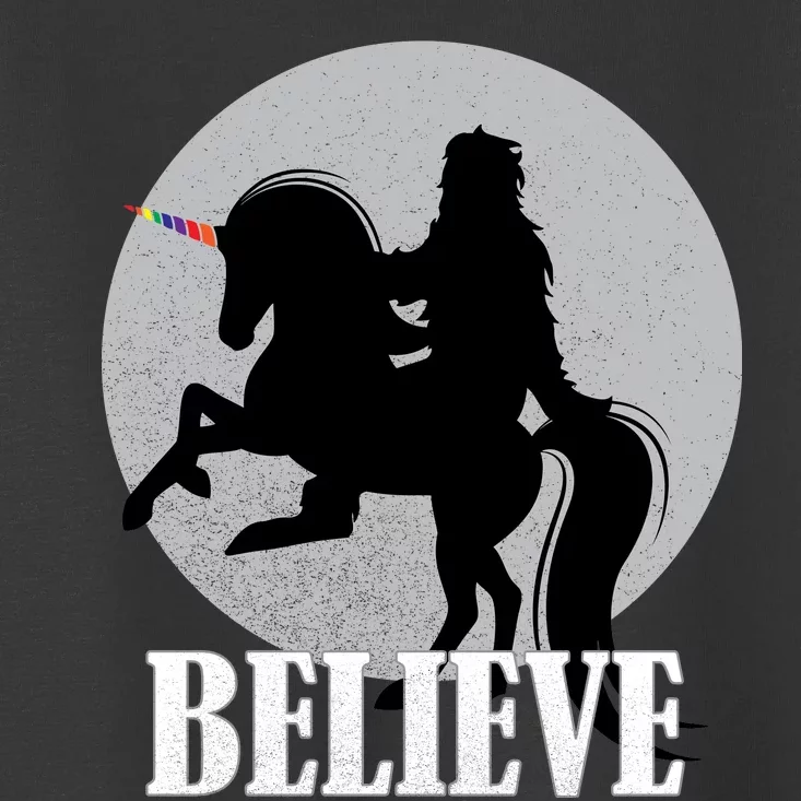 Bigfoot Riding Unicorn Believe Toddler T-Shirt