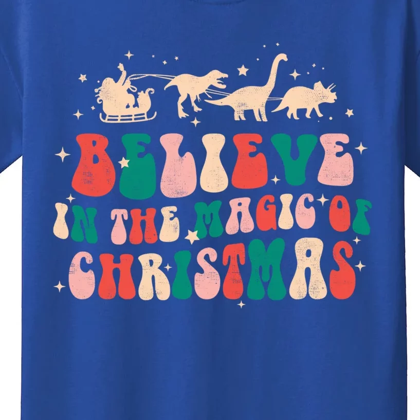 Believe In The Magic Of Christmas Groovy Retro Xmas Dinosaur Cool Gift Kids T-Shirt