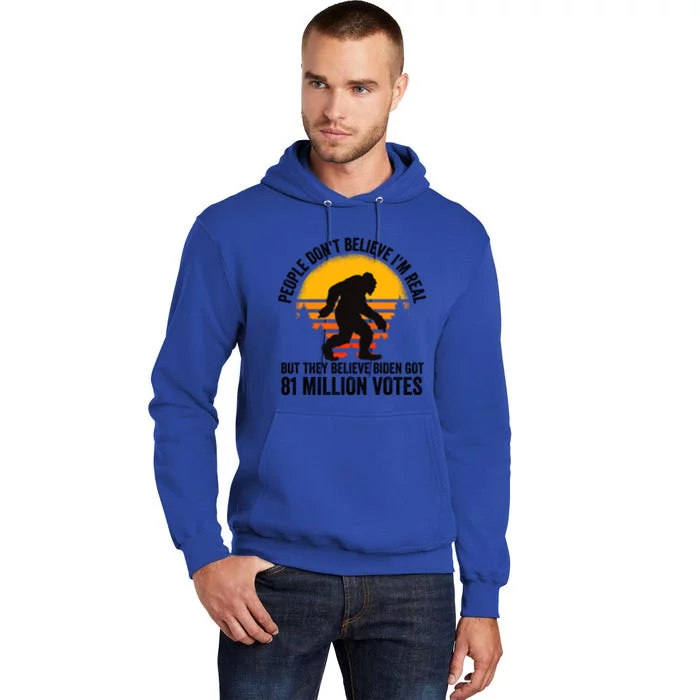 Bigfoot People DonT Believe IM Real But They Believe Biden Cool Gift Tall Hoodie