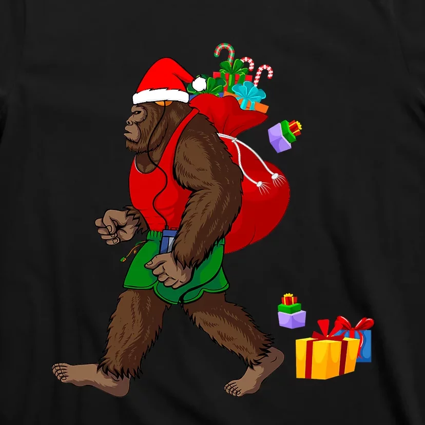 Bigfoot Santa Carrying Christmas Bag Xmas Hat Sasquatch T-Shirt