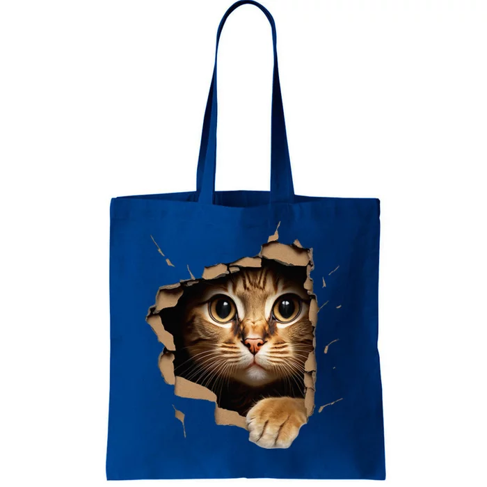 Cute kitten looks from torn fabric - Cats Tote Bag