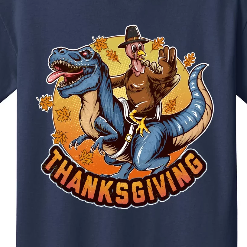 Cool Thanksgiving Turkey Riding TRex Dinosaur Kids T-Shirt