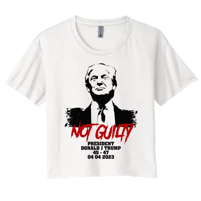 Donald Trump started selling Not Guilty mugshot Essential . Women's Crop Top Tee