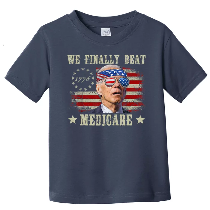 Funny Anti Joe Biden We Finally Beat Medicare American Toddler T-Shirt