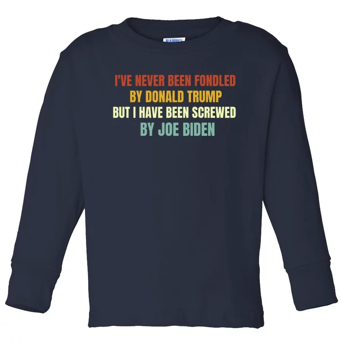 Funny I've Never Been Fondled By Donald Trump But I Have Been Screwed By Biden Toddler Long Sleeve Shirt