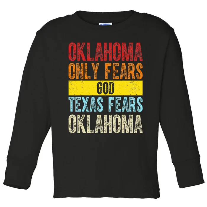 Funny Vintage Oklahoma Only Fears God Texas Fears Oklahoma Toddler Long Sleeve Shirt