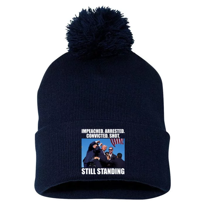 Impeached Arrested Convicted Shot Still Standing Donald Trump Pom Pom 12in Knit Beanie