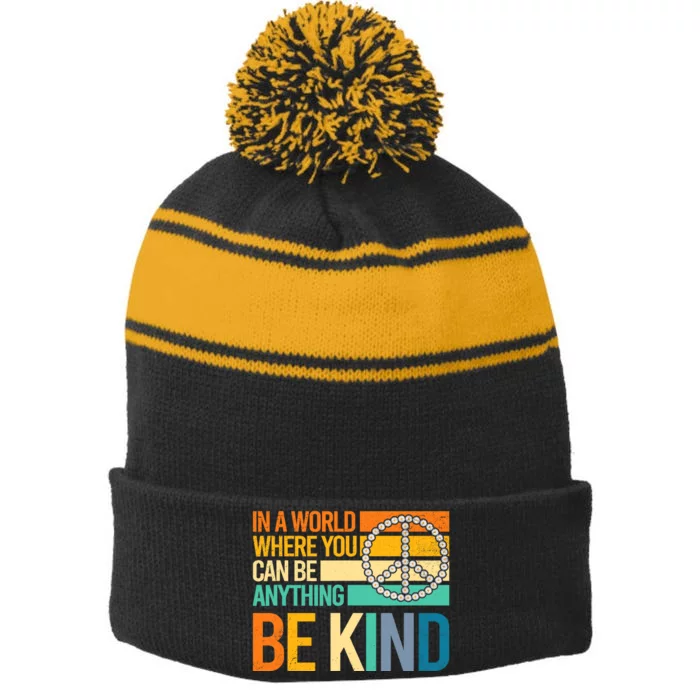 In A World Where You Can Be Anything Be Kind Peace Sign Stripe Pom Pom Beanie