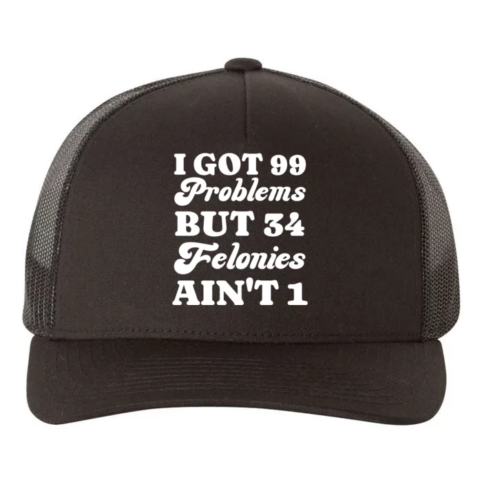 I Got 99 Problems But 34 Felonies Aint 1 Funny Donald Trump Yupoong Adult 5-Panel Trucker Hat