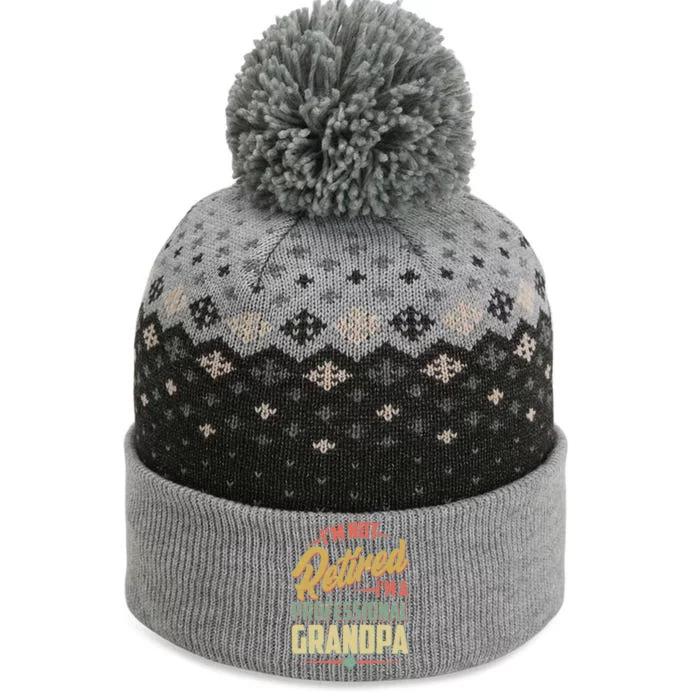 I'm Not Retired I'm A Professional Grandpa Vintage The Baniff Cuffed Pom Beanie