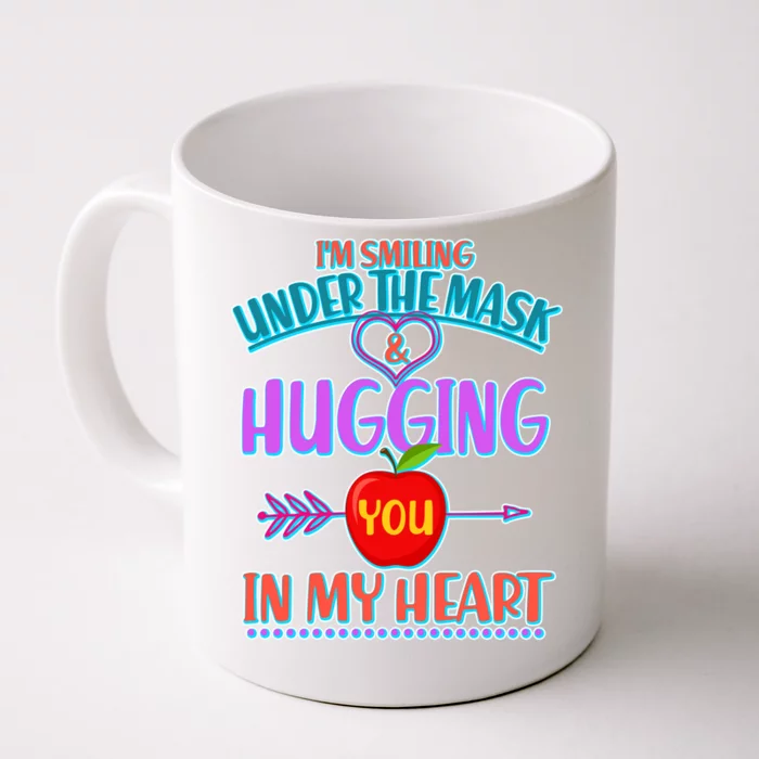 https://images3.teeshirtpalace.com/images/productImages/im-smiling-under-the-mask--hugging-you-in-my-heart--white-cfm-front.webp?width=700