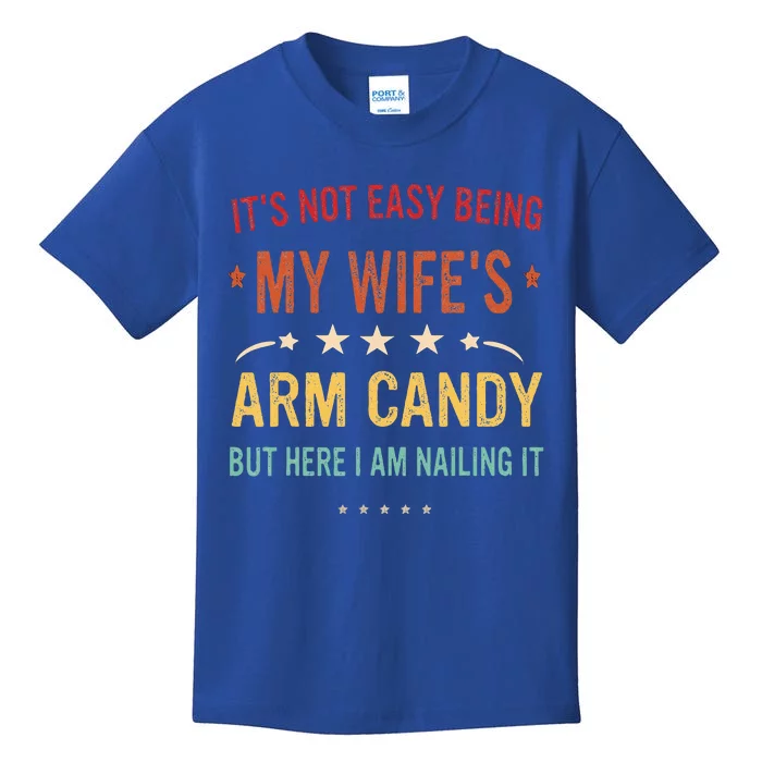 Its Not Easy Being My Wifes Arm Candy Here I Am Nailing It Kids T-Shirt