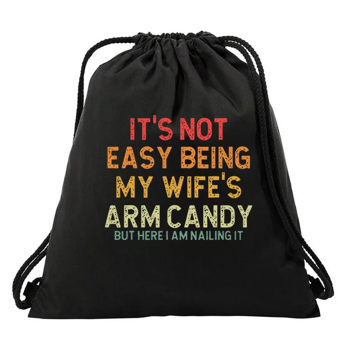 Its Not Easy Being My Wifes Arm Candy But Here I Am Nailin Drawstring Bag