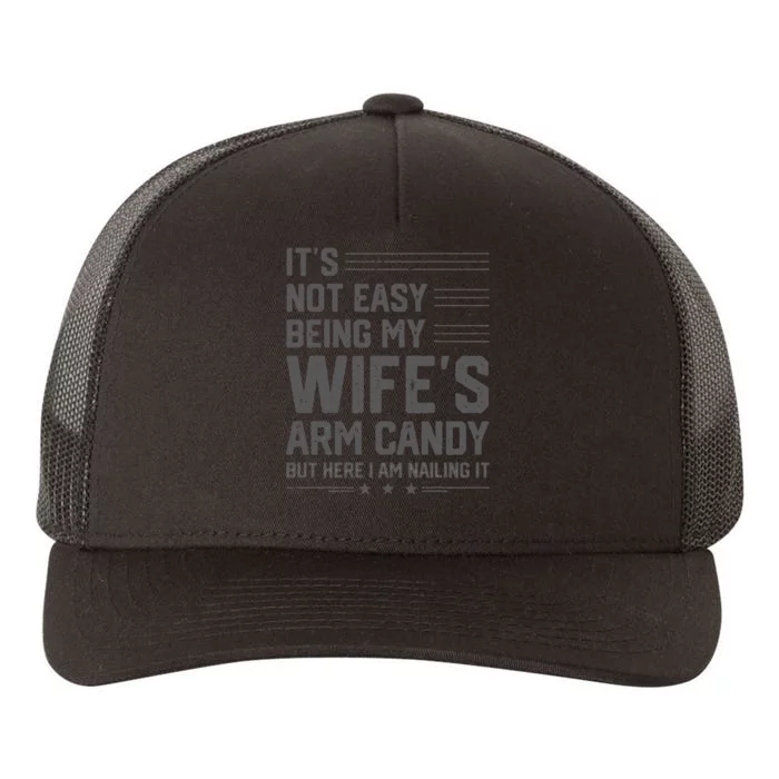 It's Not Easy Being My Wife's Arm Candy Here I Am Nailing it Yupoong Adult 5-Panel Trucker Hat