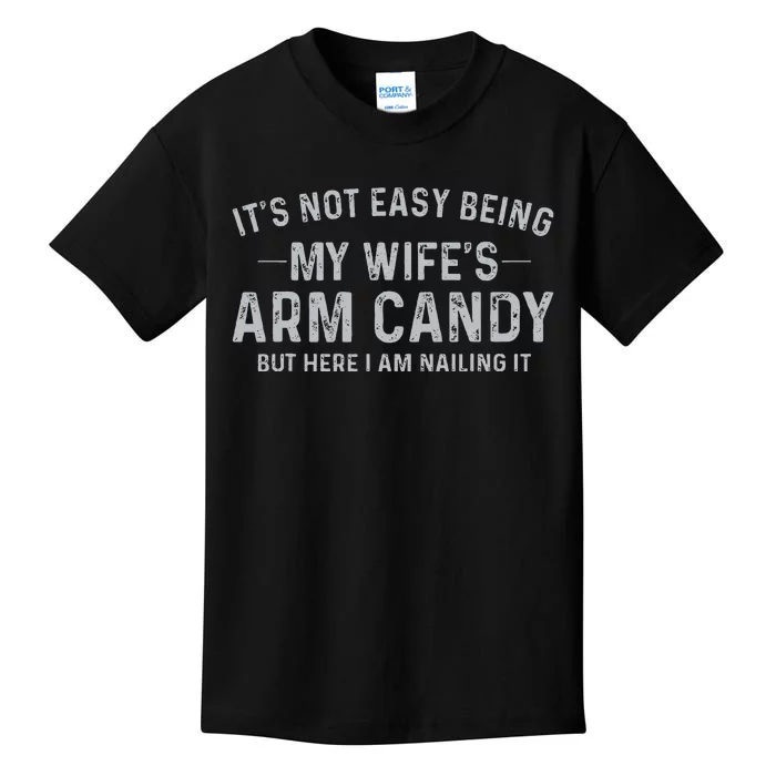 It's Not Easy Being My Wife's Arm Candy Here I Am Nailing It Kids T-Shirt