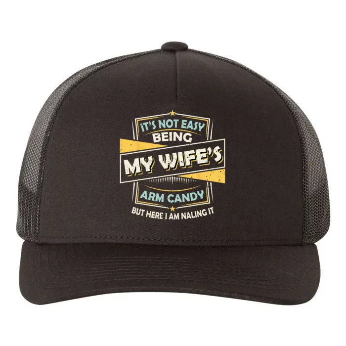 It's Not Easy Being My Wife's Arm Candy but here I am Nailin Yupoong Adult 5-Panel Trucker Hat