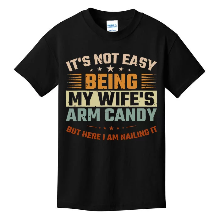 It's Not Easy Being My Wife's Arm Candy Here I Am Nailing It Kids T-Shirt