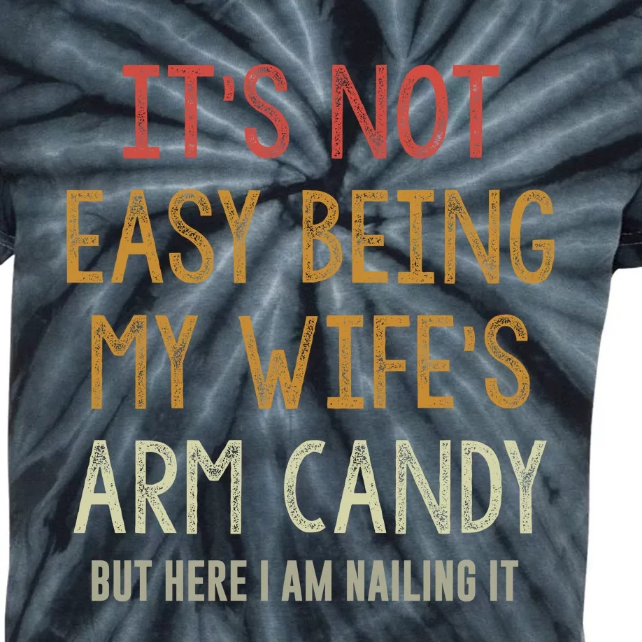 Its Not Easy Being My Wifes Arm Candy Kids Tie-Dye T-Shirt