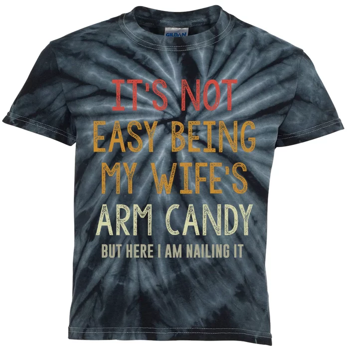 Its Not Easy Being My Wifes Arm Candy Kids Tie-Dye T-Shirt