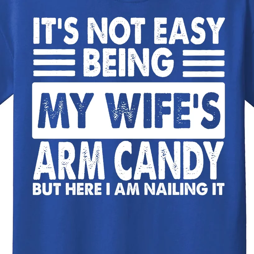 Its Not Easy Being My Wifes Arm Candy But Here I Am Nailing It Funny Kids T-Shirt