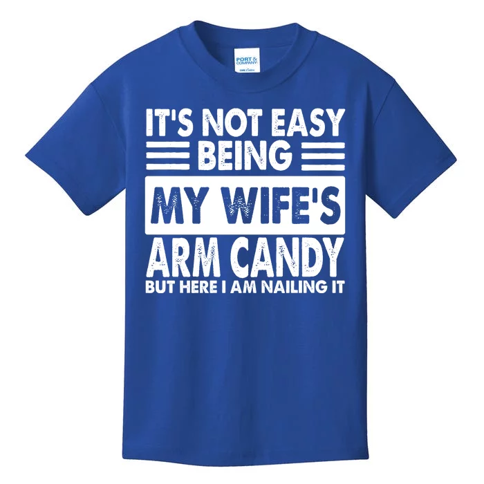 Its Not Easy Being My Wifes Arm Candy But Here I Am Nailing It Funny Kids T-Shirt