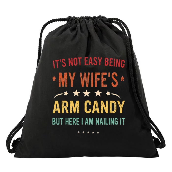 Its Not Easy Being My Wifes Arm Candy Here I Am Nailing It Drawstring Bag