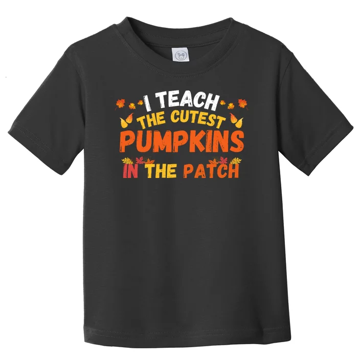 I Teach The Cutest Pumpkins Teacher Halloween Cute Jackolantern Teach Cutest Toddler T-Shirt