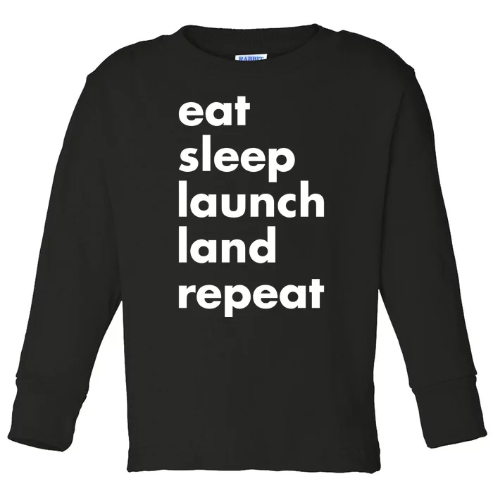 Jen Crowley Wearing Eat Sleep Launch Land Repeat Toddler Long Sleeve Shirt