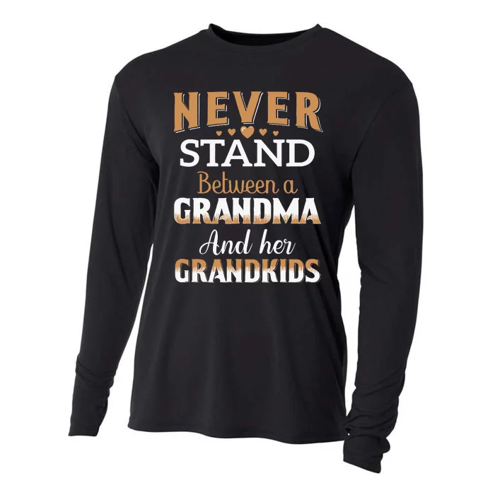 Never Stand Between A Grandma And Her Grandkids Cooling Performance Long Sleeve Crew