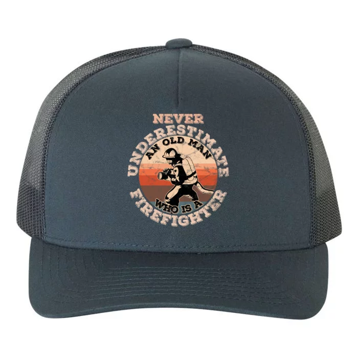 Never Underestimate An Old Who Is A Firefighter Great Gift Yupoong Adult 5-Panel Trucker Hat