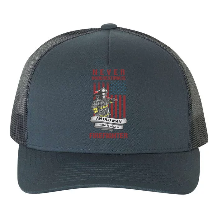 Never Underestimate An Old Who Is Also A Firefighter Gift Yupoong Adult 5-Panel Trucker Hat