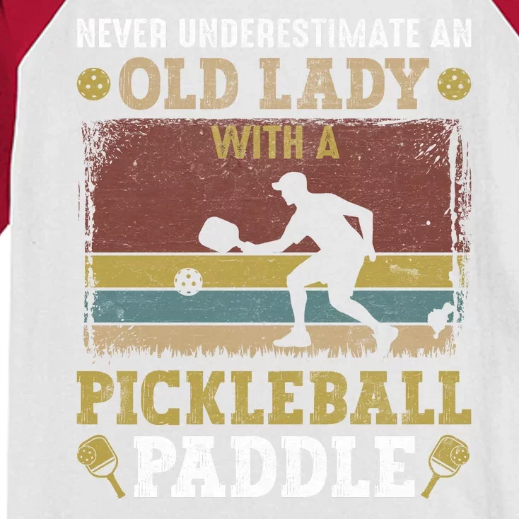 Pickleball Never Underestimate An Old Lady With A Pickleball Paddle Kids Colorblock Raglan Jersey