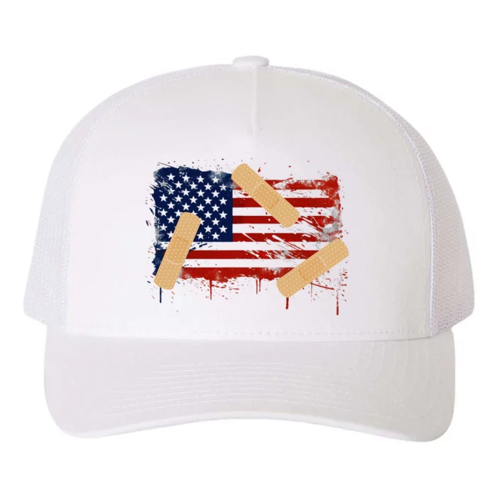 Patriotic Tattered American Flag With Bandages. Yupoong Adult 5-Panel Trucker Hat