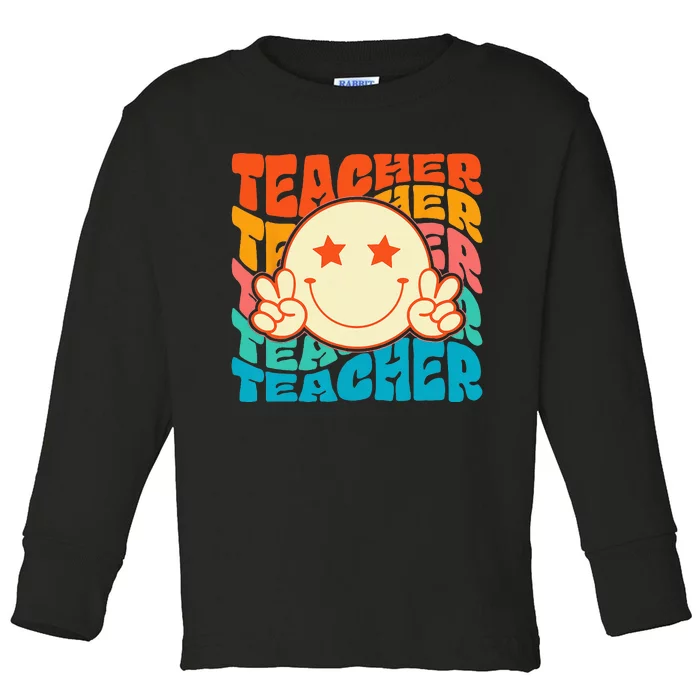 Retro Groovy Teacher Crew Smile Face Elementary School Toddler Long Sleeve Shirt