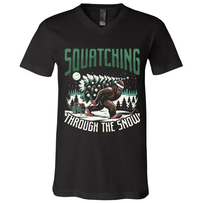 Squatching Through The Snow Bigfoot Carrying Christmas Tree V-Neck T-Shirt