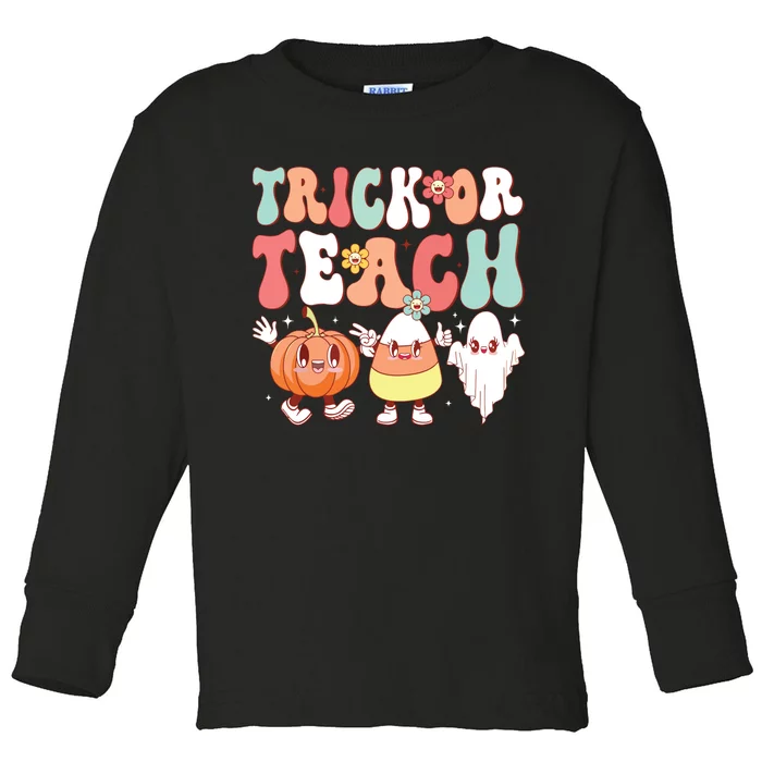 Trick Or Teach Groovy Halloween Retro Floral Ghost Teacher Toddler Long Sleeve Shirt