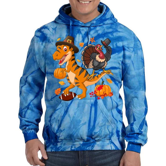 Turkey Pilgrim Riding Trex Dinosaur Thanksgiving And Football Funny Gift Tie Dye Hoodie