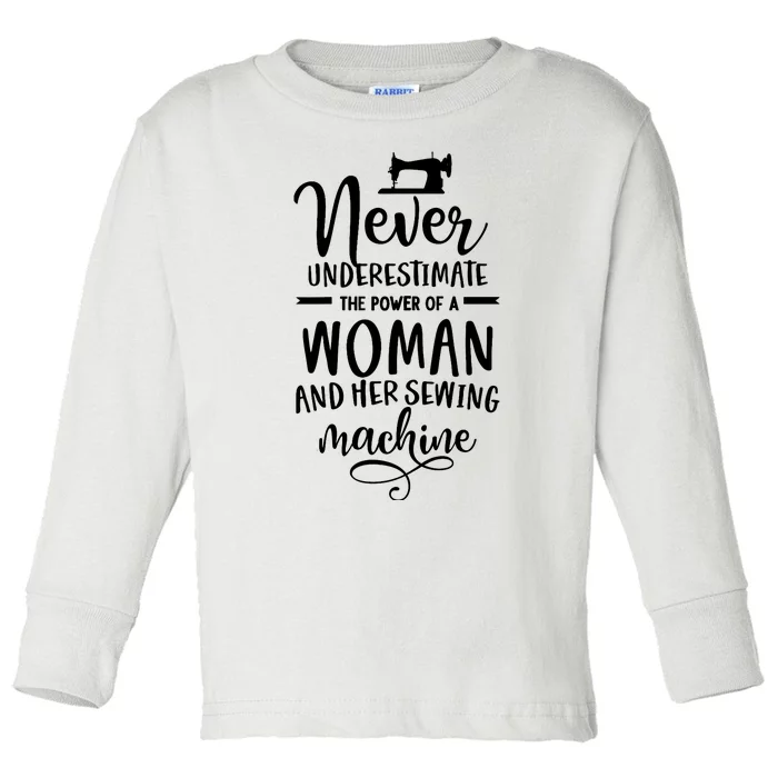 Wo Never underestimate the power of a woman with the sewing machine. Toddler Long Sleeve Shirt